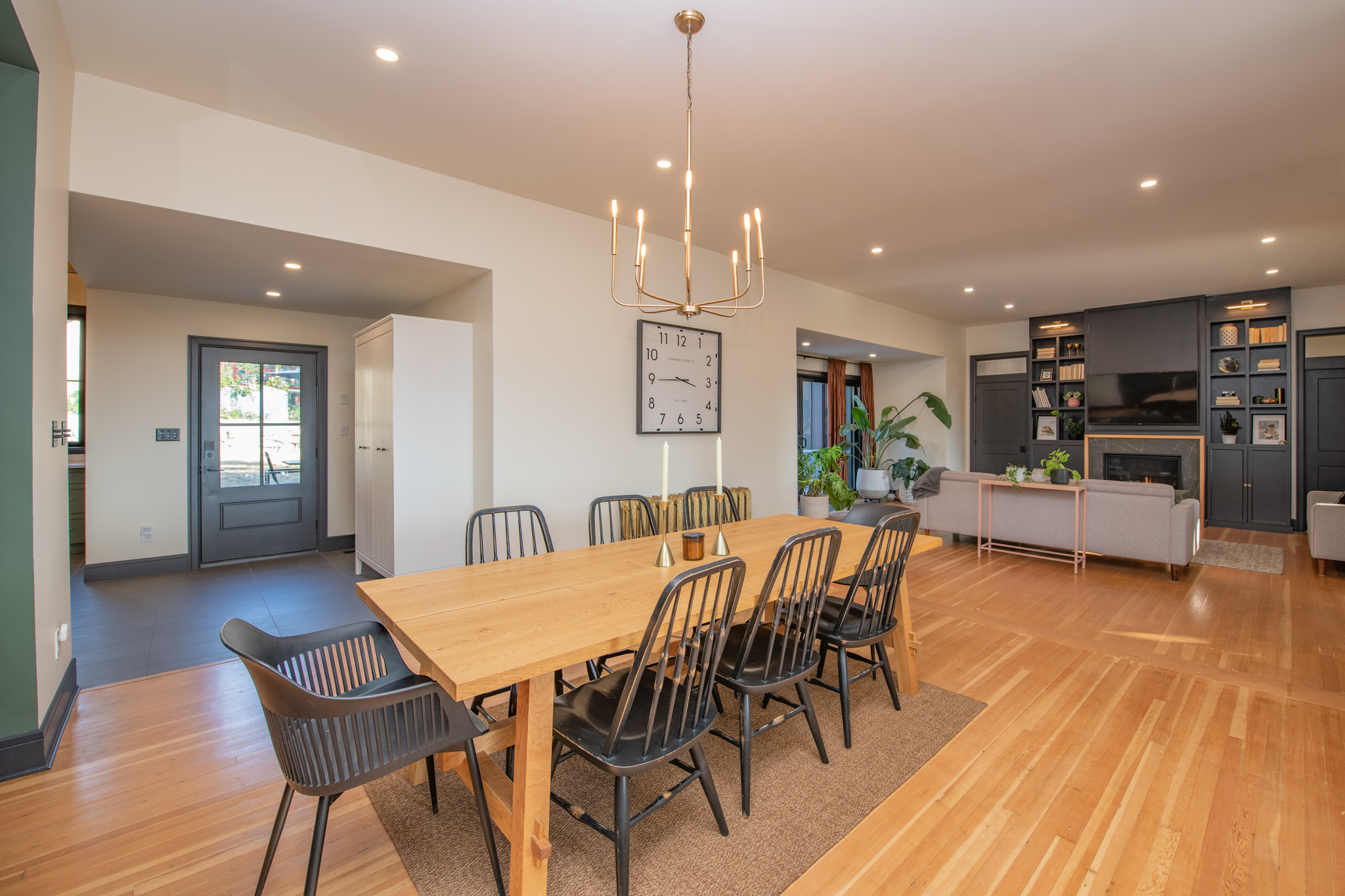 Dining room with long wood table and view to built-ins