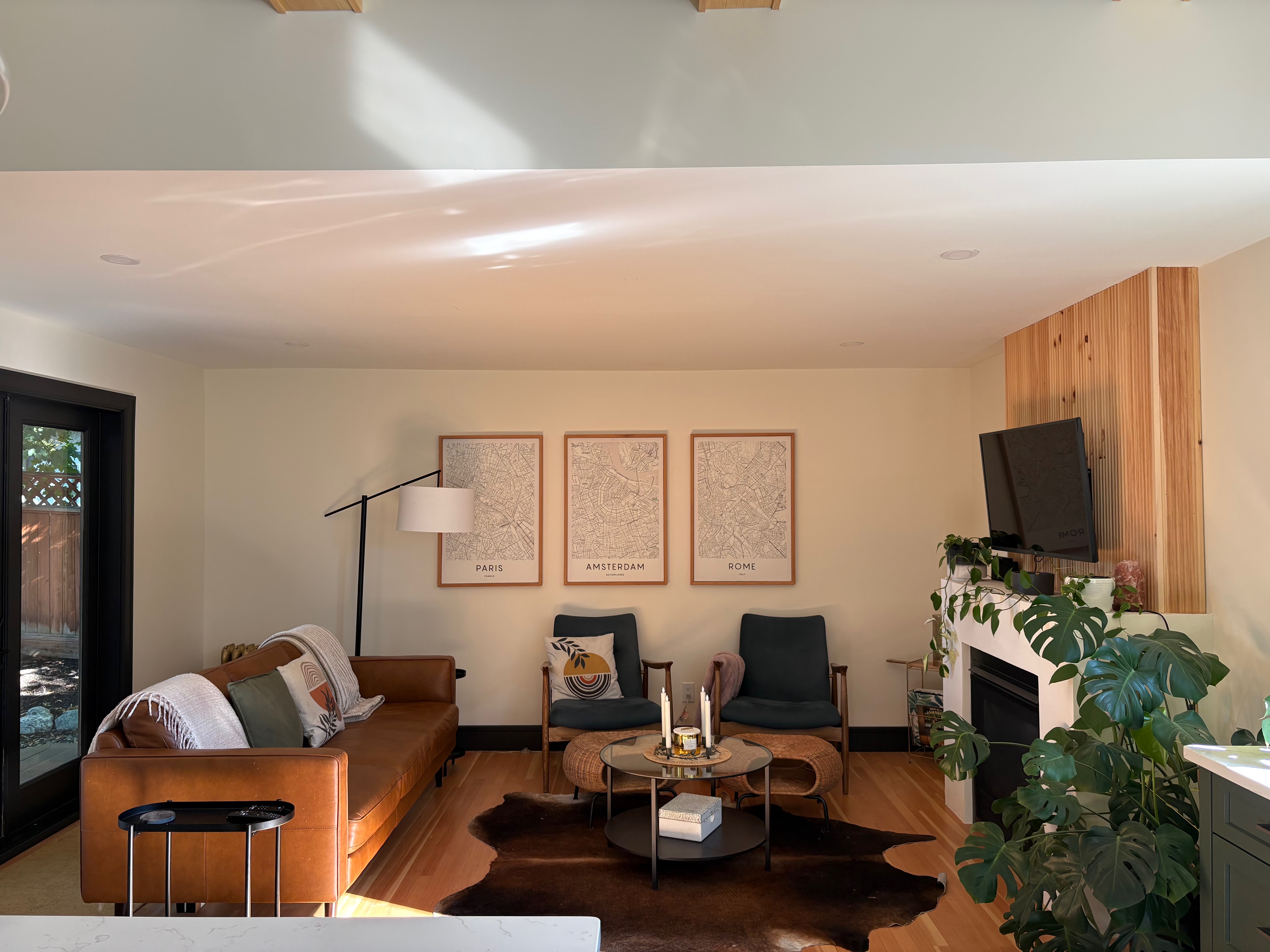 Cozy lounge with sofa, art and fireplace wall
