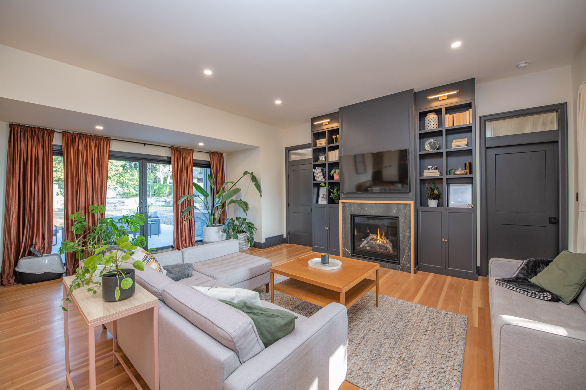 Living area with natural light and plants